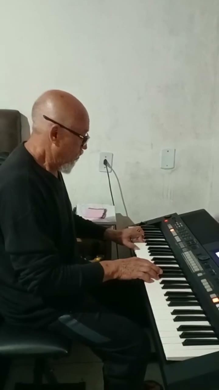 A student playing Can't Help Falling in Love on the piano.