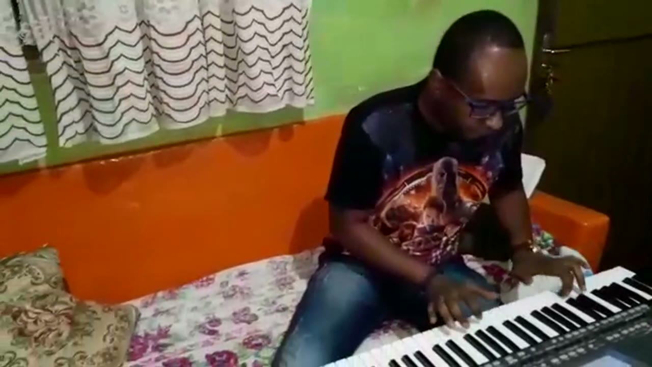 A student playing an instrumental piece on the piano.