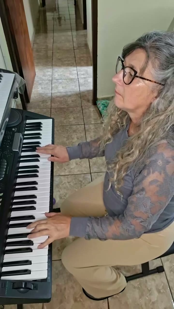 A student playing Can't Help Falling in Love on the piano.